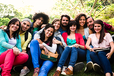 group of college students sitting together on the grass group of college students sitting together on the grass
