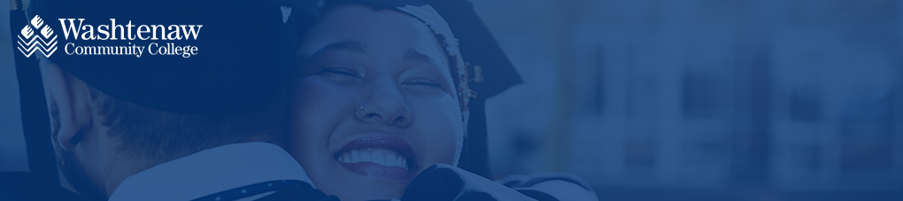 two happy graduates hugging