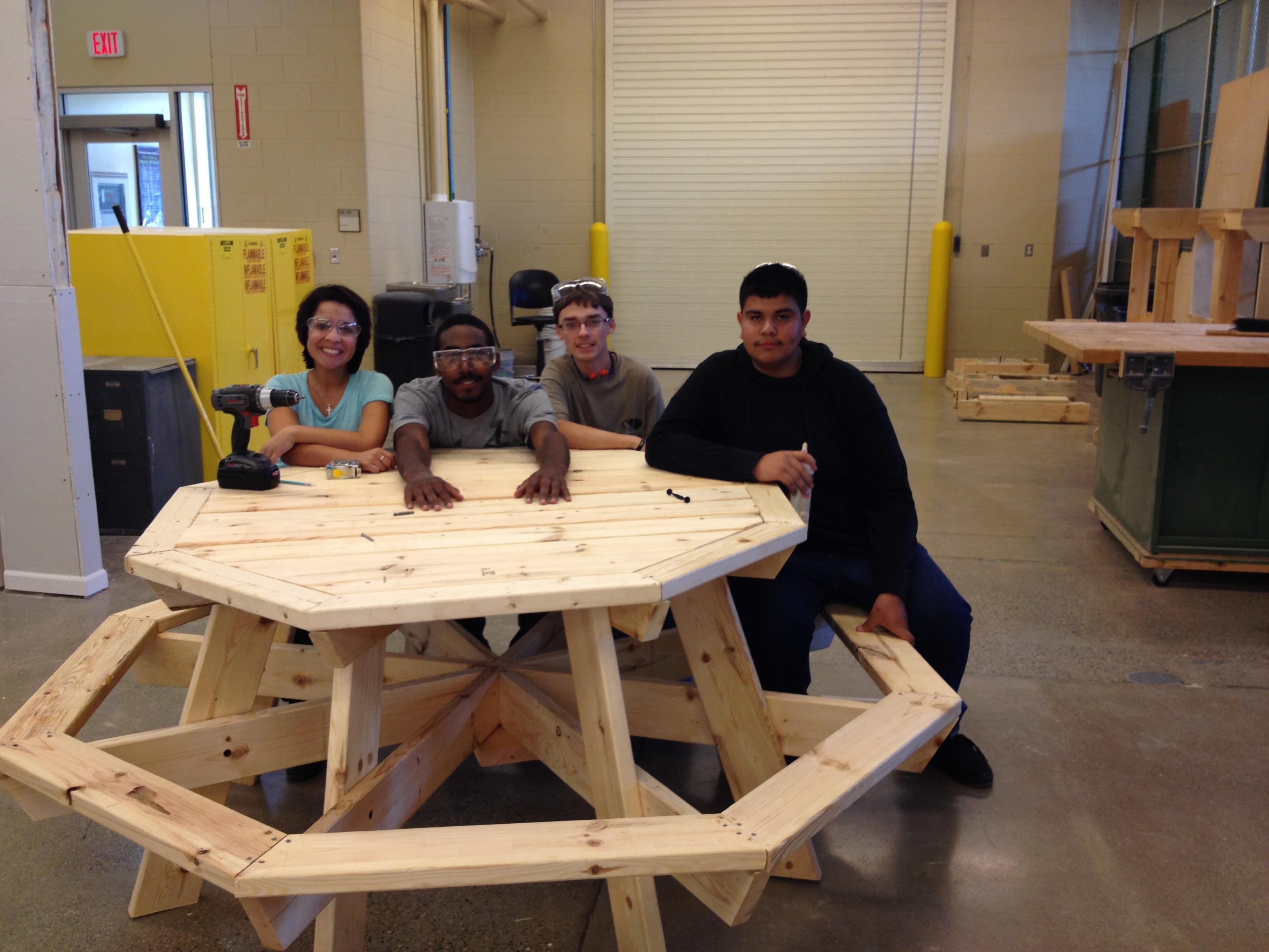 Construction students build a picnic table for local non-profit Growing Hope