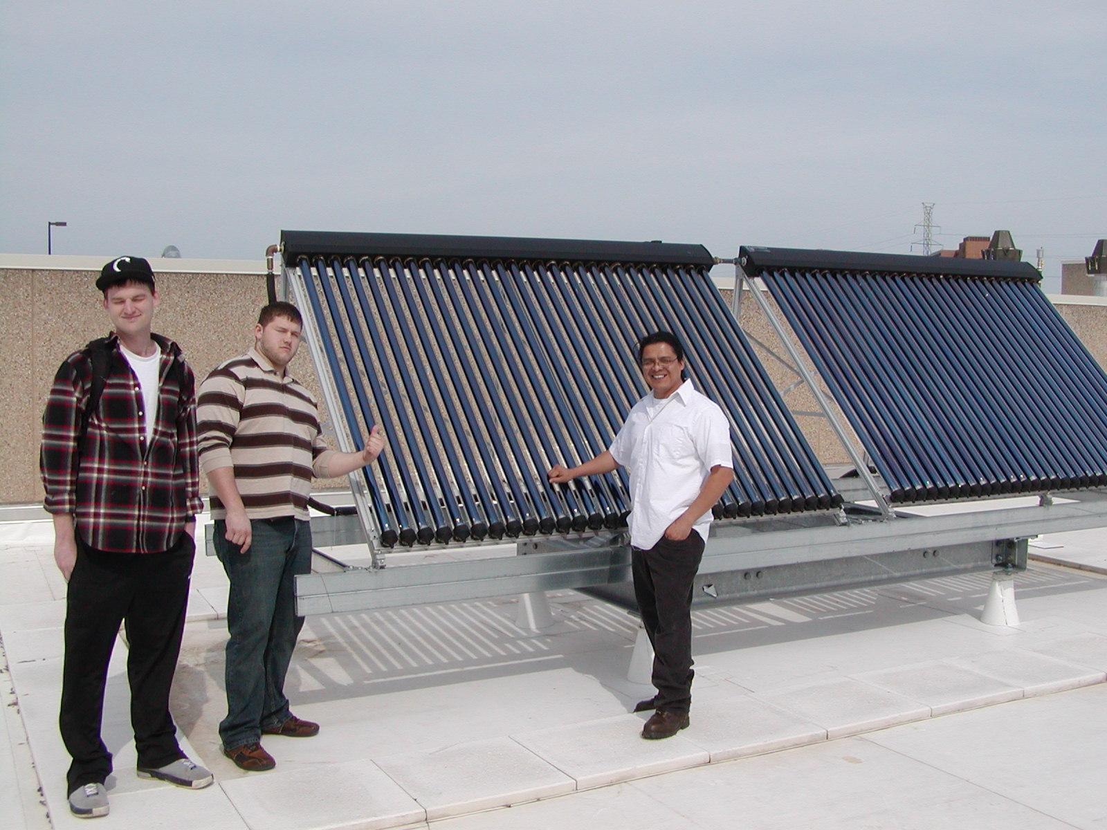 Students with solar hot water panels.