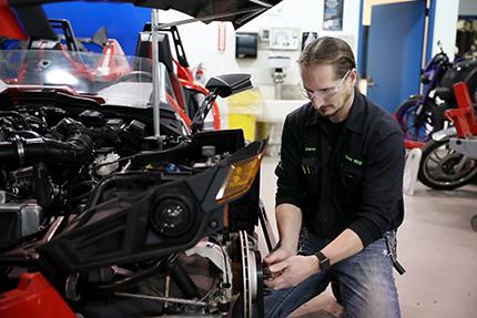 Shawn Deron, an instructor in WCC's Motorcycle Service Technology department, puts the finishing touches on the vehicle the college is displaying in the Automobili-D exhibition at NAIAS on Jan. 14-17. Deron led the multi-department project.