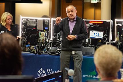 Cybersecurity instructor Mike Galea describes the college's new mobile hacking unit to the WCC Board of Trustees at its December 2018 meeting. The workbench will be on display at NAIAS.