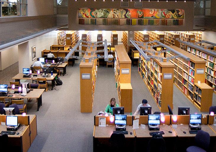 Library student spaces - side view of study tables and library