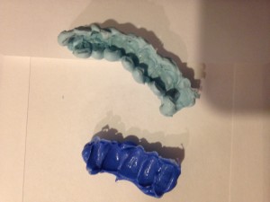 The top is [insert name] which will be used to cast the full arch while beneath is the [insert name], a.k.a. &quot;the blue goo,&quot; which will be used to cast a small section of teeth.