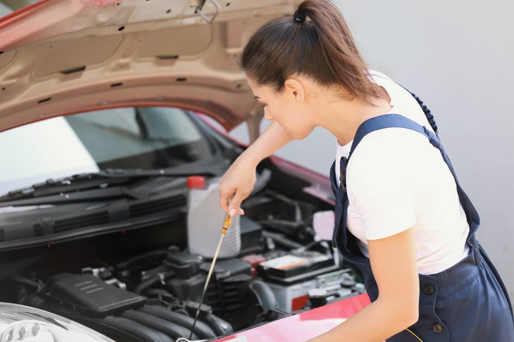 Woman Repairing Car