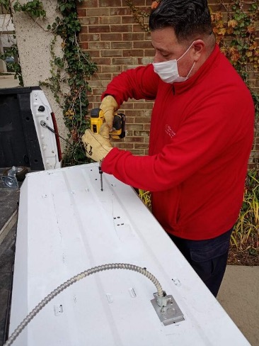 Facilities staff working on lighting improvement project