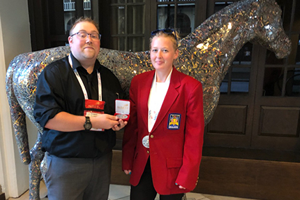 WCC student Ashlea Carravallah (right) poses with instructor Bobby Feldkamp and her SkillsUSA silver medal.