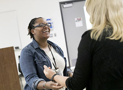 Elizabeth Connors (left) learns that she's won an Occupational Studies Outstanding Educator Award from WCC Dean of Health Sciences Dr. Valerie Greaves.