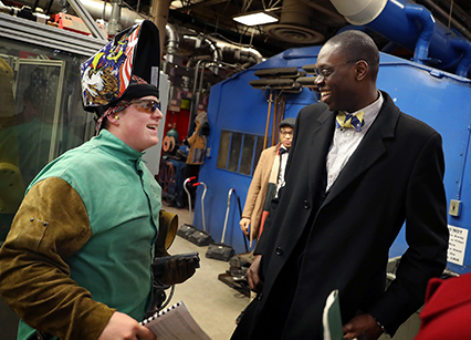Michigan Lieutenant Governor Garlin Gilchrist speaks with a Washtenaw Community College welding student Feb. 20 about their experience at the college and what they are learning in class. Gilchrist toured the Advanced Transportation Center and Center of Nursing Excellence facilities at WCC.