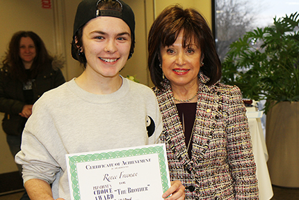 Dr. Rose B. Bellanca (right) selected a drawing by Renee Freeman (left) as winner of the President's Choice Award.