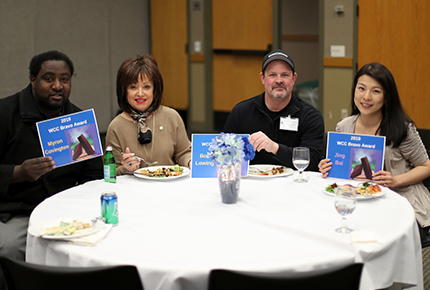 WCC President Dr. Rose B. Bellanca sits with Bravo Award winners (from left) Myron Covington, Bob Lowing and Jing Bai Swanson.