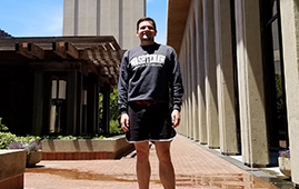 Matthew Burtell wears his WCC sweatshirt in front of Hoover Tower on the campus of Stanford University.