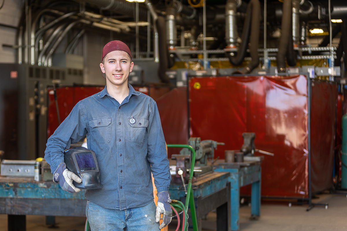 Caleb Rogers standing outside WCC welding lab