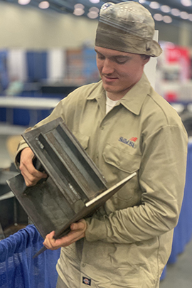 WCC student Evan Pasternak shows off some of his work completed during the SkillsUSA National Leadership and Skills Conference in Louisville, Kentucky.