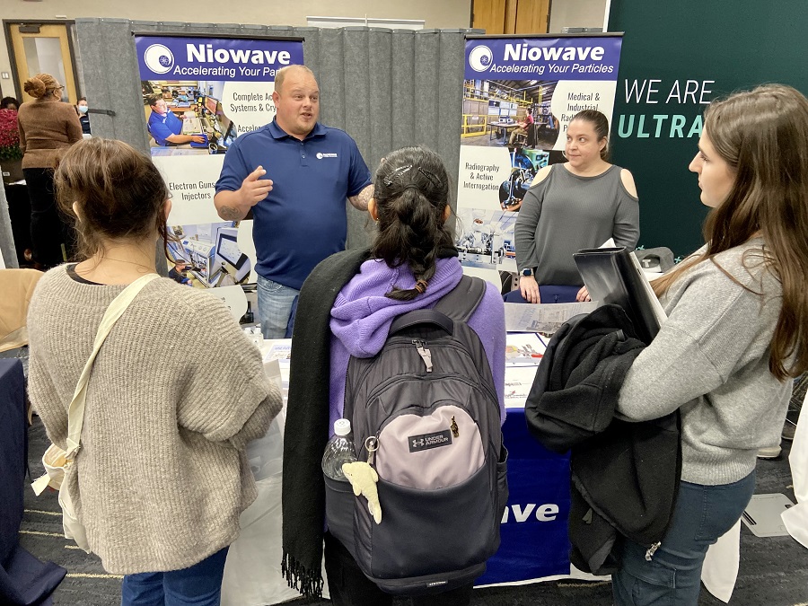 Students gather around employer at Career Fair