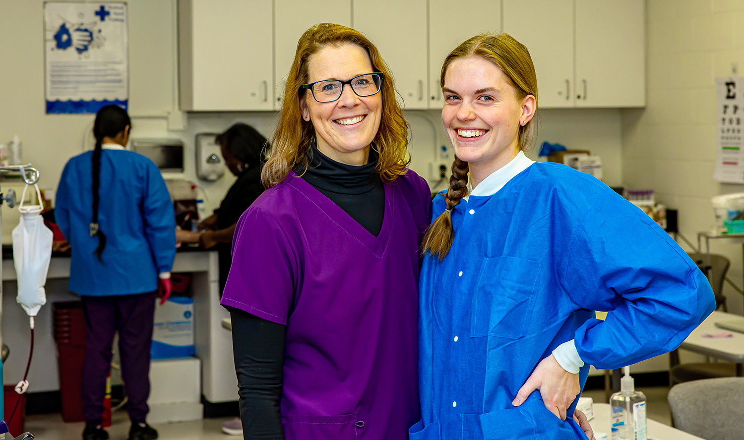 Emily and Julie Friedrichsen pose in a Medical Assisting classroom