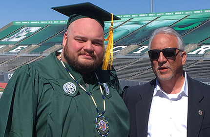 WCC alumnus Thomas Klemm (left) and his father, Richard Klemm, prior to commencement ceremonies at Eastern Michigan University.