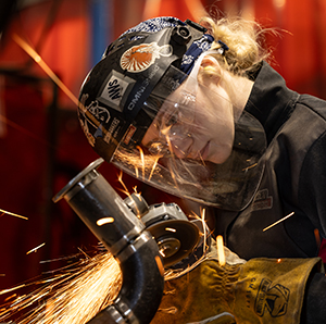 Mikala Sposito using grinder