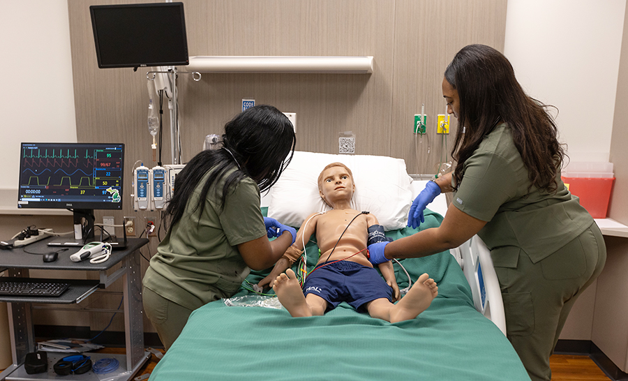 Nursing students with Pediatric Hal