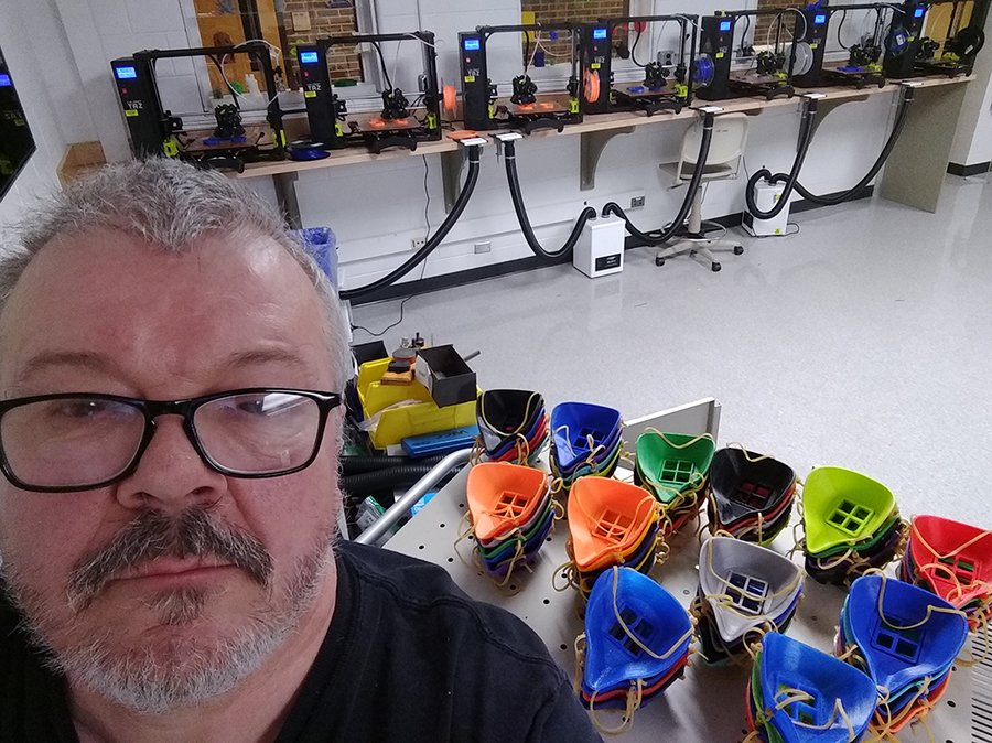 Tom Penird in front of 3D printed masks