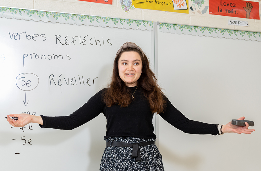 Annie Peurach at a whiteboard in class