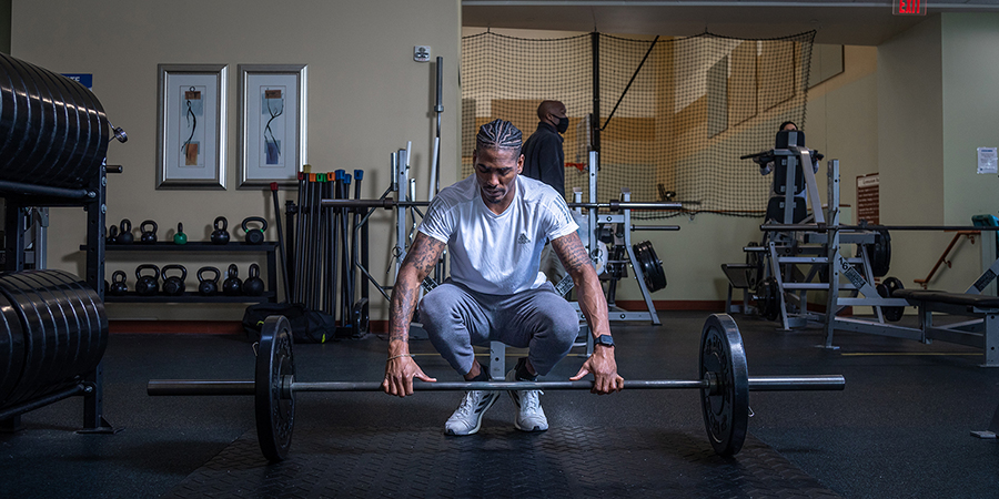 Donald Scott II lifting weights