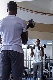 Donald Scott II lifting weights