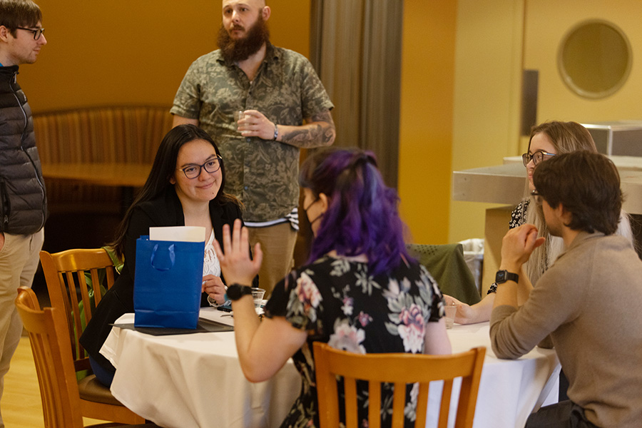 STEM Scholars students chatting after an event in their honor.