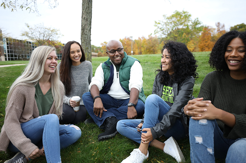 WCC students sitting in a circle