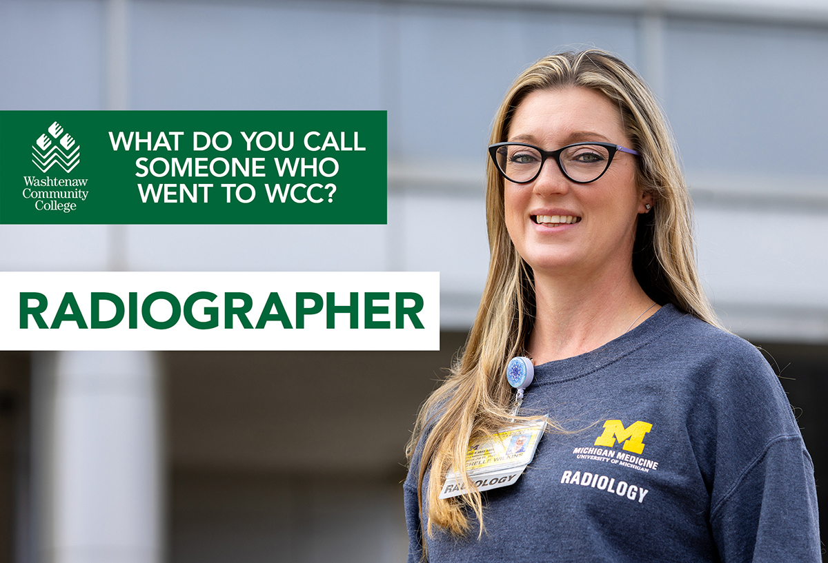 Smiling woman with glasses wearing Michigan Medicine Radiography shirt.