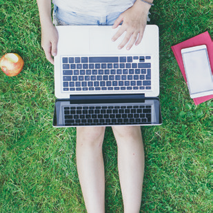 Student on laptop outside Student on laptop outside