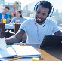 Student studying wearing headphones