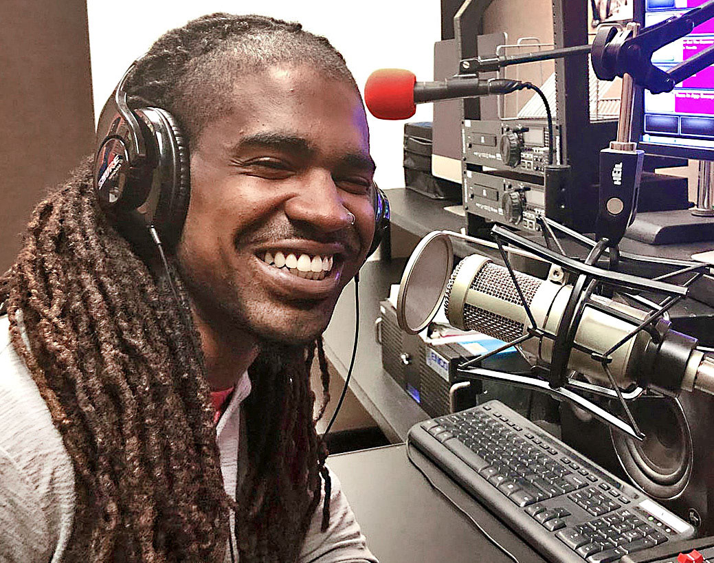 WCC radio dj sitting in front of equipment