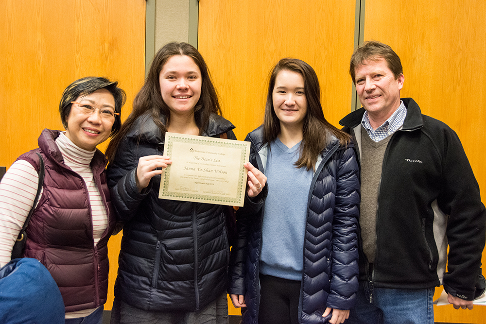 WCC student Janna Wilson poses with family after receiving a certificate for achieving High Honors during the Fall 2016 semester. | Photo by CJ South