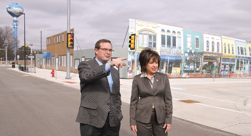 Dr. James R. Sayer, director of the University of Michigan Transportation Research Institute, shows WCC President Dr. Rose B. Bellanca around the streets of Mcity, a 32-acre simulated urban environment used to test connected and autonomous vehicle technology. Photo by Lynn Monson Dr. James R. Sayer, director of the University of Michigan Transportation Research Institute, shows WCC President Dr. Rose B. Bellanca around the streets of Mcity, a 32-acre simulated urban environment used to test connected and autonomous vehicle technology. Photo by Lynn Monson