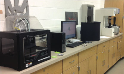 A long line of state-of-the art technology is available to WCC students allowing them to work across academic disciplines. This photo (L to R) shows the 3D printer (also known as a makerbot) sitting beside a computer for both the 3Dprinter and a 3D scanner (located behind the black curtain). Two metal hardness testers complete the grouping. This technology allows students in the Welding and Fabrication and the new Engineering and Design Technology departments to create and design using the latest in software and production methods.