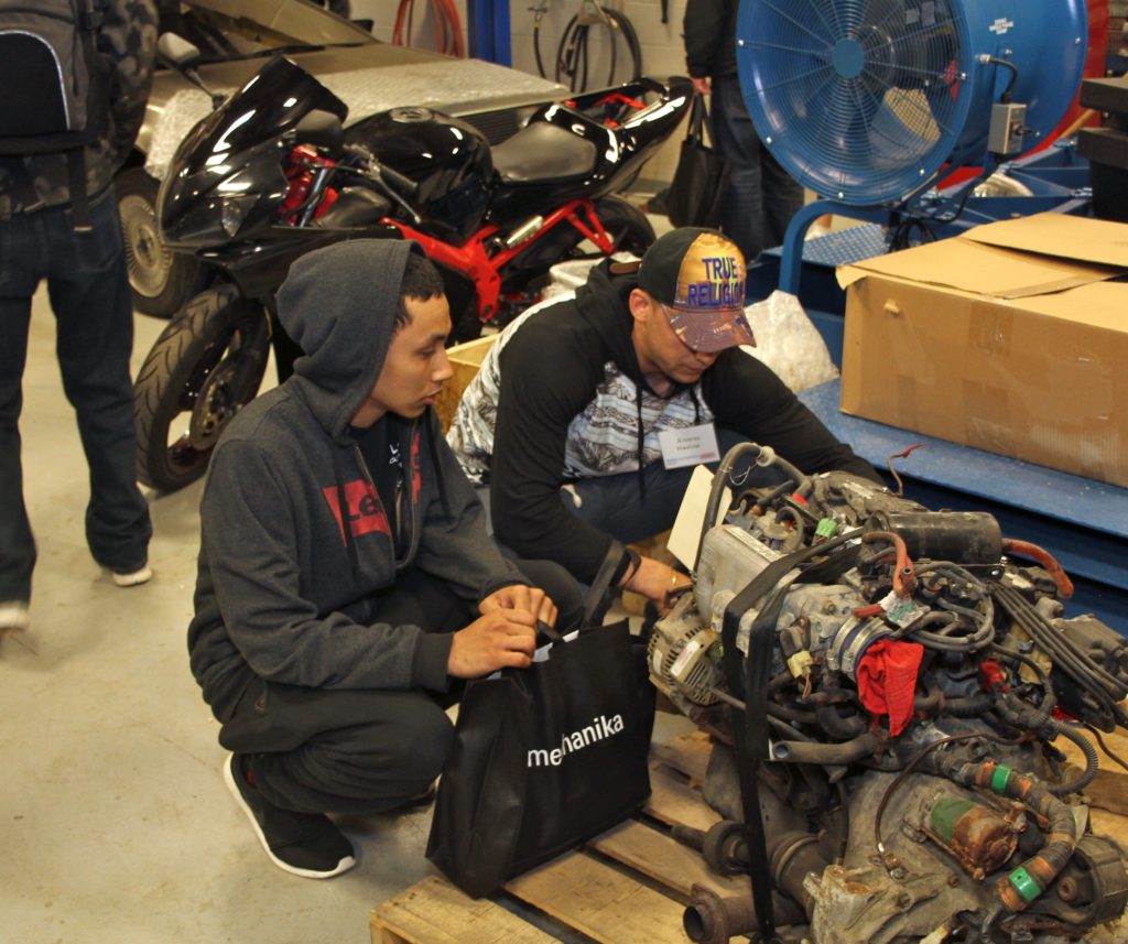 Attendees examine an engine during the Automechanika event at WCC. (Photo by Lynn Monson) Attendees examine as engine during the Automechanika event at WCC. (Photo by Lynn Monson)