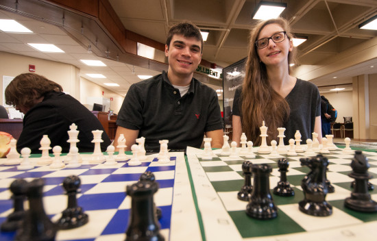 Tyler Strauss and Claire Dykstra, Co-Presidents of the WCC Chess Club, hosted a table at Winter Welcome Day and challenged attendees to a game of chess. Photo by Jessica Bibbee