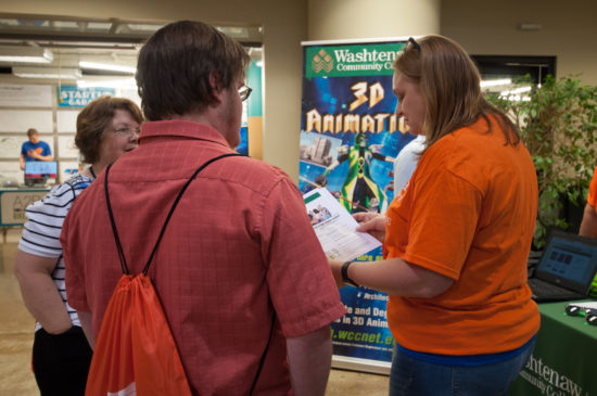 Victoria Bennett (right), an academic associate in the Business and Computer Technologies Division at WCC, shares information on the dual-enrollment program with a local high school student. (Photo by Jessica Bibbee)