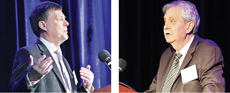 Richard Wallace (left) and Dr. George Fulton speak at the Washtenaw Economic Club luncheon. Photo by Lynn Monson