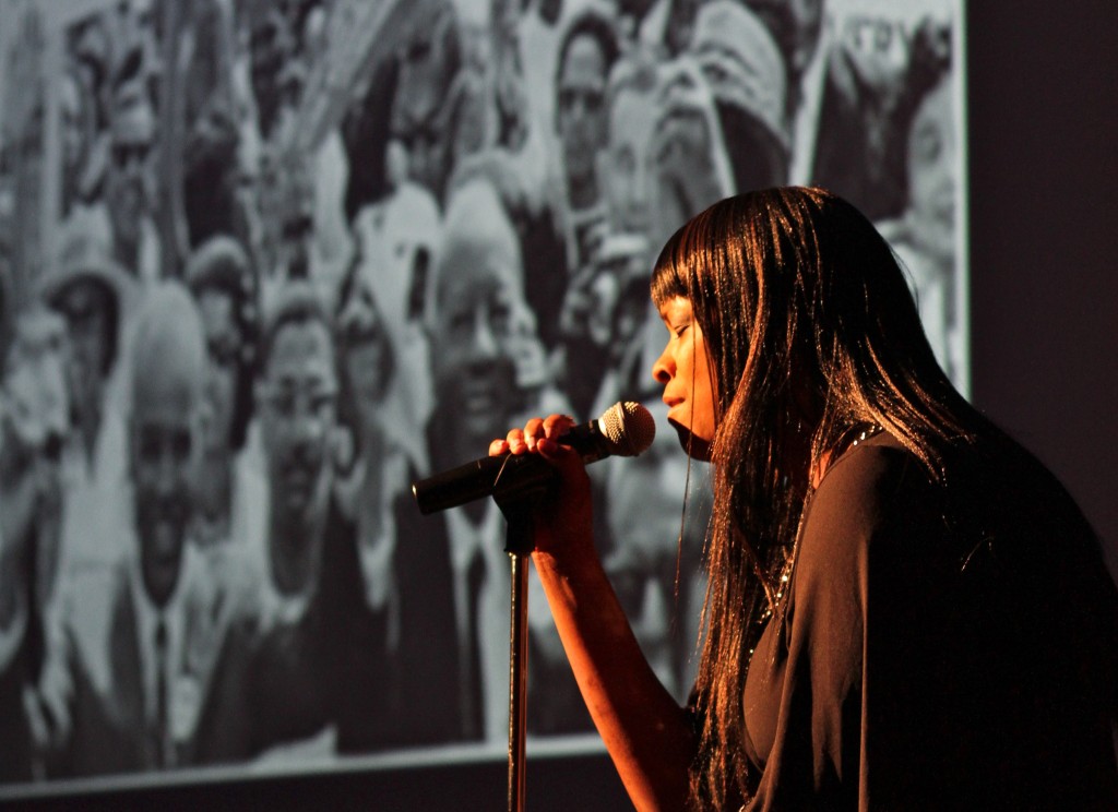 WCC English Instructor Dr. Kimberly Jones sings Sam Cooke’s “A Change Gonna Come” in front of a backdrop of photos documenting American civil rights history. Photo by Lynn Monson WCC English Instructor Dr. Kimberly Jones sings Sam Cooke’s “A Change Gonna Come” in front of a backdrop of photos documenting American civil rights history. Photo by Lynn Monson