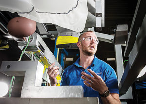 Toyota technician and WCC graduate John Smith explains airbag and component testing. (Brian Watkins/Toyota)