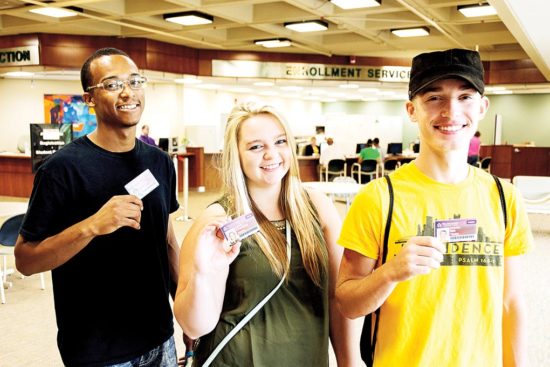 New students (from left) Marques Maddox, Charlette Mason and Ian Timbs show off their WCC photo IDs. (Photo by CJ South)