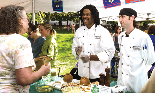 PHOTO BY KIMBERLY BORECKI-TROIANOWCC Culinary Arts instructor Derek F. Anders Jr. (center) and lab assistant Chris J. Troiano talk about their program during a recent on-campus event.