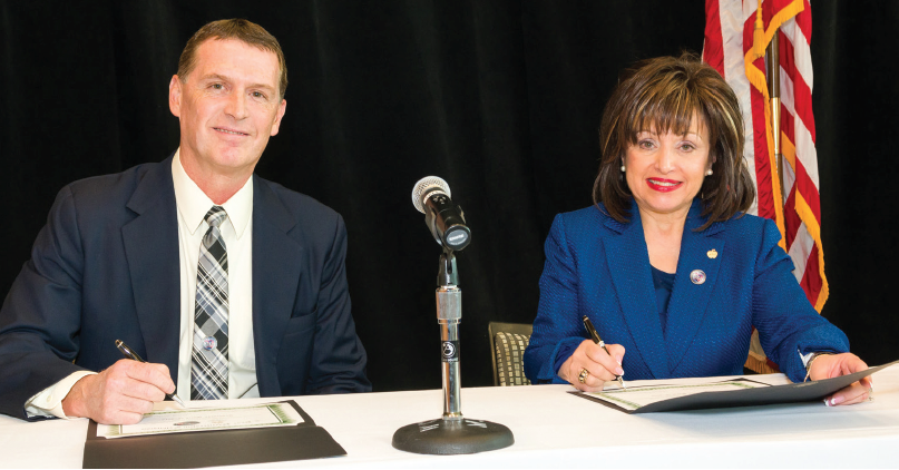 Lee Worley and Dr. Rose Bellanca sign the contract extension