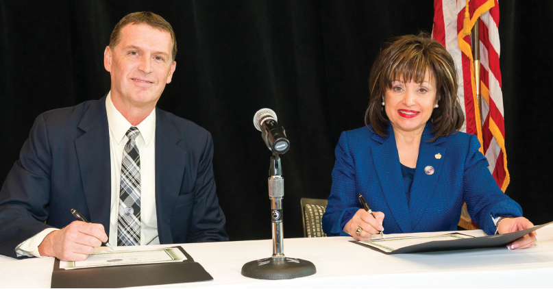 Lee Worley and Dr. Rose Bellanca sign the contract extension Lee Worley and Dr. Rose Bellanca sign the contract extension
