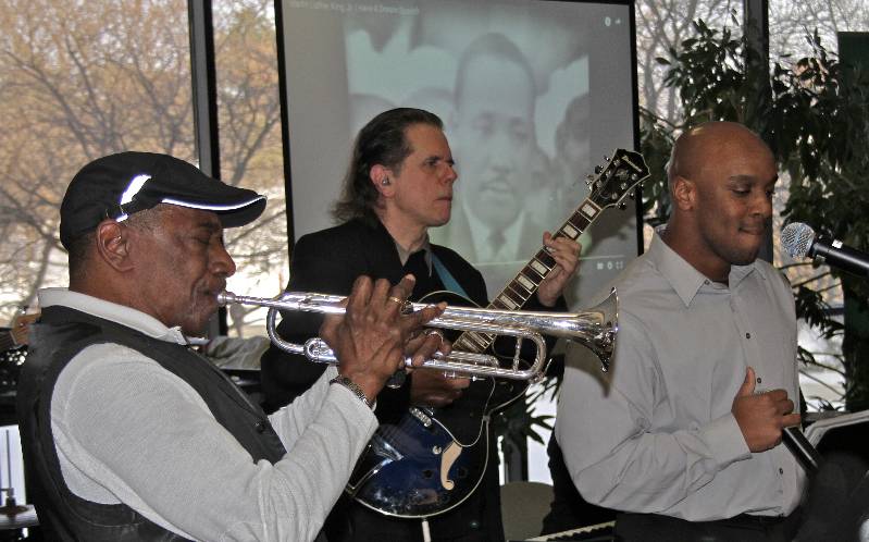 WCC Jazz Faculty band members (from left) Duane Wells, Steve Somers and Julius Tompkins perform in front of an image of Martin Luther King Jr., during the college’s observance of MLK Day. Photo by Lynn Monson