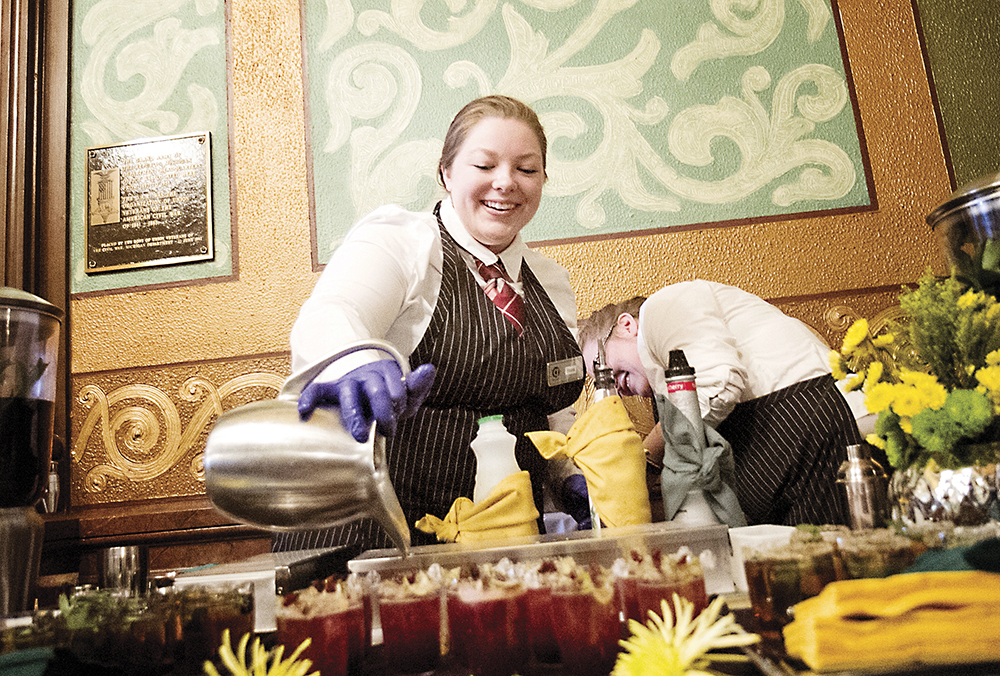 WCC student Anastasia Baumgardner pours a non-alcoholic version of a Michigan Mule at the Michigan State Capitol during Community College Day on April 19. | Photo by Kelly Gampel