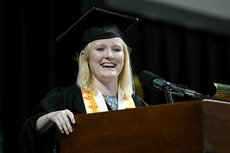 Abbee Elwell gives the student address at the Washtenaw Community College commencement ceremony on May 18. Elwell simultaneously graduated with an associate degree from WCC and a high school diploma from Washtenaw Technical Middle College. (Photo by Lon Horwedel)