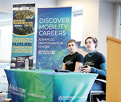 students speaking at table